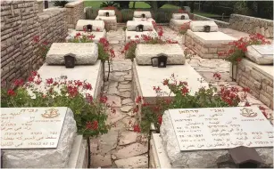  ?? (Anna Ahronheim) ?? GRAVES OF Druze soldiers and police officers are seen in the village of Hurfeish.