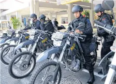  ?? AFP ?? Indonesian police prepare to patrol at Ngurah Rai Airport in Denpasar on Indonesia’s resort island of Bali, one day after a series of explosions hit the Indonesian capital Jakarta.