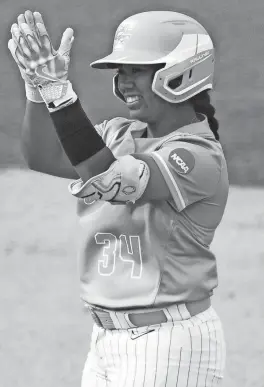  ?? SAUL YOUNG/NEWS SENTINEL ?? Tennessee’s Destiny Rodriguez celebrates after reaching second base during the NCAA softball super regional against Texas on May 27 in Knoxville.