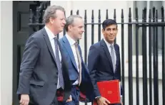  ??  ?? Britain’s Scotland Secretary Alister Jack (L), Foreign Secretary and First Secretary of State Dominic Raab (C) and Chief Secretary to the Treasury Rishi Sunak arrive in Downing Street in London on Wednesday for a meeting of the cabinet. — AFP