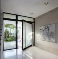  ?? ROBIN HILL/TOUZET STUDIO VIA AP ?? This undated photo provided by Touzet Studio shows an entryway in a Florida home by Touzet Studio. Designer Jacqueline Gonzalez Touzet says terrazzo flooring, as seen here, is a great choice due to its durability and long-lasting beauty.