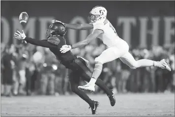  ?? GREGORY BULL — THE ASSOCIATED PRESS ?? Stanford receiver JJ Arcega-Whiteside, right, and San Diego State safety Trey Lomax go for a long pass in Saturday’s game.