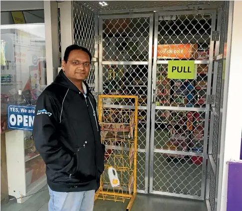  ?? PHOTO: FLORENCE KERR/STUFF ?? Hamilton shopkeeper Sandip Patel has installed a cage in an attempt to stop further aggravated robberies at his Hamilton store.