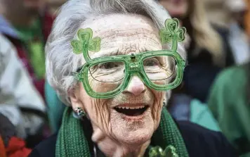  ?? ANDRES KUDACKI / AP ?? A woman cheers during the St. Patrick’s Day Parade on Saturday in New York.