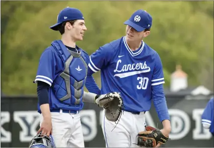  ?? PAUL DICICCO — FOR THE NEWS-HERALD ?? Gilmour catcher Vinny Bandwen and starter Ben DeMell talk during DeMell’s no-hitter against South Range on May 8.