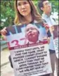  ?? AFP ?? Relatives of passengers missing on MH370 hold a demonstrat­ion in Putrajaya on Friday.