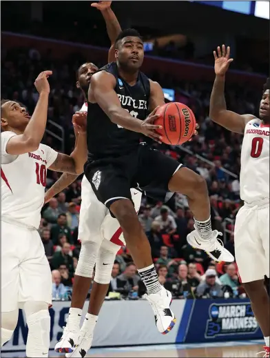  ?? Associated Press ?? To the hoop: Butler forward Kelan Martin makes a layup against Arkansas during the first half of the NCAA college basketball tournament, Friday in Detroit..Butler won 79-62.