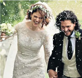  ??  ?? Rose Leslie and Kit Harrington, who star as Ygritte and Jon Snow in Game of Thrones, leave together following their wedding service yesterday at Rayne Church, Kirkton of Rayne in Aberdeensh­ire.