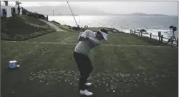  ?? GODOFREDO A. VÁSQUEZ/AP ?? KEITH MITCHELL PREPARES TO HIT A DRIVE on the 7th tee of the Pebble Beach Golf Links during the third round of the AT&T Pebble Beach Pro-am tournament in Pebble Beach, Calif., on Saturday.