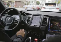  ??  ?? SAN FRANCISCO: An Uber driverless car waits in traffic during a test drive in San Francisco. The ride-hailing company is refusing to obey demands by the state’s Department of Motor Vehicles that it stop picking up San Francisco passengers in specially...