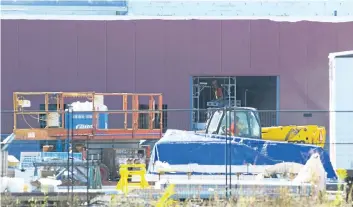  ?? PHOTOS BY JULIE JOCSAK/POSTMEDIA FILE PHOTO ?? Constructi­on workers are shown in this photo from early October at the Pelham twin-pad arena and community centre rising southwest of Regional Road 20 and Rice Road.