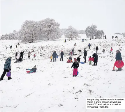  ??  ?? People play in the snow in Aberfan. Right, a snow plough at work on the A470 and, below, a street in Penygraig, Rhondda