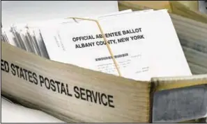  ?? AP ?? A box of absentee ballots waiting to be counted at the Albany County Board of Elections in 2020.