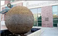  ?? NWA Democrat-Gazette file photo ?? The World Peace Prayer Fountain, created by Hank Kaminsky, is in front of the Fayettevil­le Town Center.