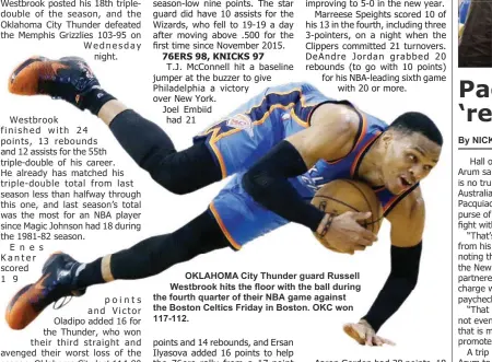  ??  ?? OKLAHOMA City Thunder guard Russell Westbrook hits the floor with the ball during the fourth quarter of their NBA game against the Boston Celtics Friday in Boston. OKC won 117-112.