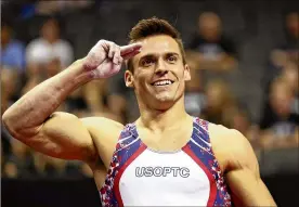  ?? JAMIE SQUIRE / GETTY IMAGES ?? Sam Mikulak salutes after competing on the pommel horse during the U.S. gymnastics championsh­ipsSaturda­y night in Kansas City, Missouri.