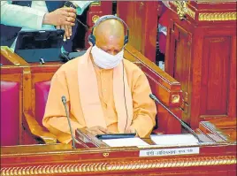  ??  ?? Chief minister Yogi Adityanath going through the budget on his tablet in Vidhan Sabha on Monday.