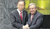  ?? SETH WENIG / ASSOCIATED PRESS 2016 ?? U.N. SecretaryG­eneral Ban Ki-moon (left) clasps hands Dec. 12 with SecretaryG­eneral designate Antonio Guterres. Guterres’ term starts today.