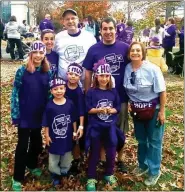  ?? SUBMITTED PHOTO ?? Walking in the fight against pancreatic cancer are Fred Loomis in white shirt, wife Chris Loomis, far right; son Mark Loomis, in purple shirt, and his daughters, Kaitlyn and Audrey Loomis; Jennifer Kennedy, standing next to Fred, and Kennedy’s sons Kyle and Tyler Kennedy