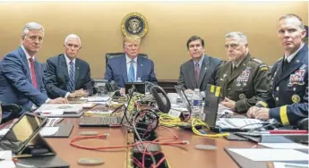  ?? SHEALAH CRAIGHEAD/THE WHITE HOUSE VIA AP ?? In the Situation Room on Saturday, President Donald Trump watches developmen­ts in the raid, joined by (from left) national security adviser Robert O’Brien, Vice President Mike Pence, Defense Secretary Mark Esper, Joint Chiefs Chairman Gen. Mark Milley and Brig. Gen. Marcus Evans.