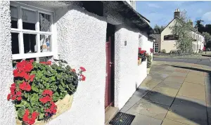  ??  ?? “Geraniums at Glamis village provide a splash of autumn colour,” says reader John Crichton, who supplied the photograph.