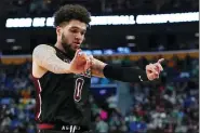  ?? FRANK FRANKLIN II — THE ASSOCIATED PRESS ?? New Mexico State guard Teddy Allen reacts during the second half of the team’s college basketball game against Connecticu­t in the first round of the NCAA men’s tournament Thursday, March 17, 2022, in Buffalo, N.Y.