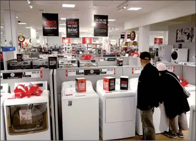  ?? Bloomberg News/SAUL MARTINEZ ?? Shoppers browse appliances at a J.C. Penney Co. store in Garden City, N.Y., in this file photo. Penney started selling major appliances again after a failed reinventio­n that started in 2012.