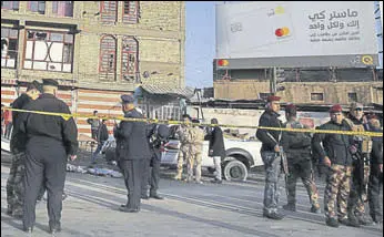 ?? AFP ?? Iraqi security forces cordon off the area where the double suicide bombing took place.