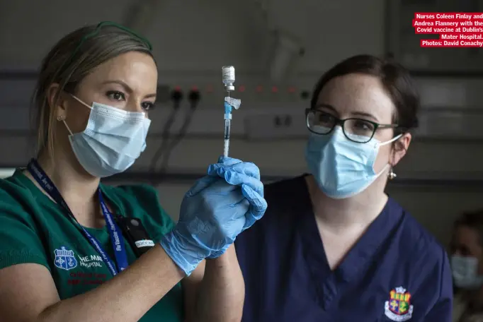  ??  ?? Nurses Coleen Finlay and Andrea Flannery with the Covid vaccine at Dublin’s Mater Hospital. Photos: David Conachy