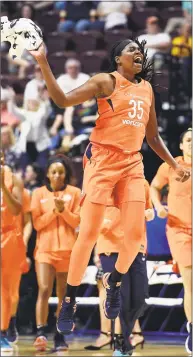  ?? Sean D. Elliot / Associated Press ?? Sun center Jonquel Jones comes off the bench cheering as the Minnesota Lynx call a timeout to stop a Sun run in Saturday’s game.