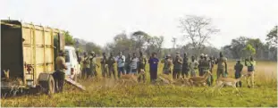  ?? ?? DNPW police officers and FQM Trident Limited witnessing the releasing of animals in the park.