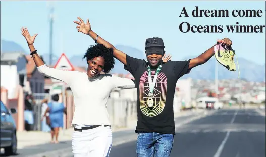  ?? PICTURE HENK KRUGER ?? TRIUMPHANT: Two Oceans Marathon winner Lungile Gongqa and his wife Ivy at their home in Khayelitsh­a. Lungile became the first Cape Town athlete to win the Two Oceans 56km marathon since Don Hartley in 1973.