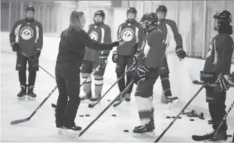  ?? DAX MELMER ?? Marianne Watkins, an NHL skating consultant, works with players from the Windsor Essex Catholic District School Board’s sport academies Thursday during a teaching session at Central Park Athletics in Windsor.