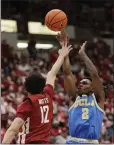  ?? YOUNG KWAK — THE ASSOCIATED PRESS ?? UCLA's Dylan Andrews, right, shoots and is fouled by Washington State's Isaiah Watts in Saturday's game.