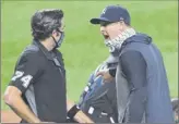  ?? Sarah Stier / Getty images ?? Yankees manager Aaron Boone exchanges words with umpire John tumpane in the first inning on friday.