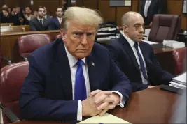  ?? BRENDAN MCDERMID — POOL PHOTO VIA AP ?? Republican presidenti­al candidate and former President Donald Trump sits in the courtroom at his criminal trial at Manhattan state court in New York, Monday.