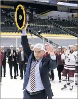  ?? GREGORY SHAMUS — GETTY IMAGES ?? UMass hockey coach Greg Carvel celebrates his team’s victory in the NCAA hockey final Saturday.