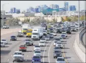  ?? Ross D. Franklin The Associated Press ?? Early rush-hour traffic rolls Friday along Interstate 10 in Phoenix. Major reconstruc­tion is set to start next year.