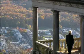  ?? READING EAGLE ?? A visitor to the Pagoda enjoys the autumnal view of southeast Reading.