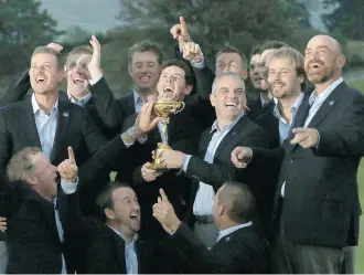  ?? Scott Heppell/ The Associated Press ?? Europe team captain Paul McGinley, front right, and his team celebrate after winning the Ryder Cup in easy fashion over the United States at Gleneagles, Scotland, on Sunday.