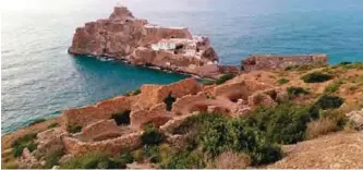  ??  ?? A picture shows a general view of Penon de Velez de la Gomera, a peninsula within Spanish territory, off the coast of Morocco’s Bades beach in Al-Hoceima national park.