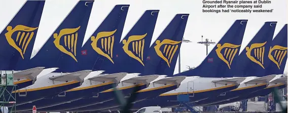  ?? Pictures: GETTY, PA ?? Grounded Ryanair planes at Dublin Airport after the company said bookings had ‘noticeably weakened’