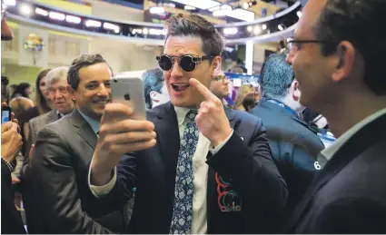  ?? Bloomberg ?? Matthew Kobach, manager of digital and social media at the New York Stock Exchange, takes a selfie while wearing a pair of Snapchat Spectacles. Manufactur­ers hope a new generation of tech specs will excite consumer interest