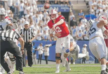  ?? | AP ?? Wisconsin quarterbac­k Alex Hornibrook set career highs in passing yards, passing touchdowns and completion­s on Saturday.