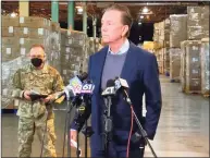  ?? Christine DeRosa / Hearst Connecticu­t Media ?? Gov. Ned Lamont speaks at a news conference in New Britain on Friday, after 426,000 COVID-19 test kits were delivered overnight.