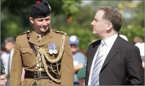  ??  ?? Former first minister Jack Mcconnell with a Scots soldier at the Bayeux cemetery in 2004