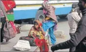  ??  ?? Woman waiting at the Jind bus stand with her baby as buses were in short supply. MANOJ DHAKA/HT