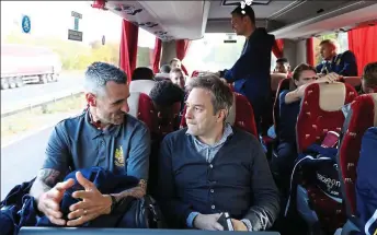  ??  ?? Travelling in hope: Sportsmail’s Matt Barlow (above, right) joins the Hitchin players and staff on the journey to their game with Bedworth United