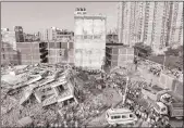  ??  ?? At least five people were killed and several feared trapped under the rubble of two adjacent buildings which collapsed in Greater Noida on the outskirts of the national capital.