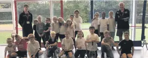  ??  ?? Year four pupils at Bollington Cross Primary get a taste of squash